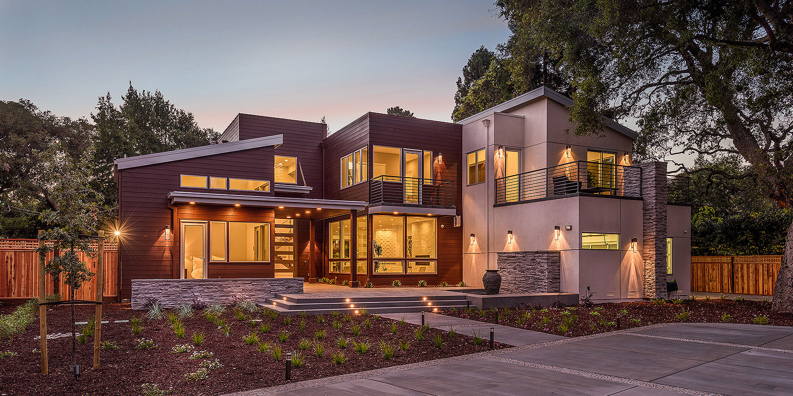 Beautiful Luxury Home Exterior with Colorful Sunset Sky